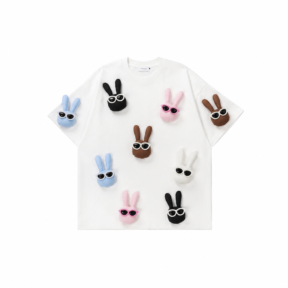 A soft white base that highlights the playful bunny colors — easy to style, effortless to wear.
