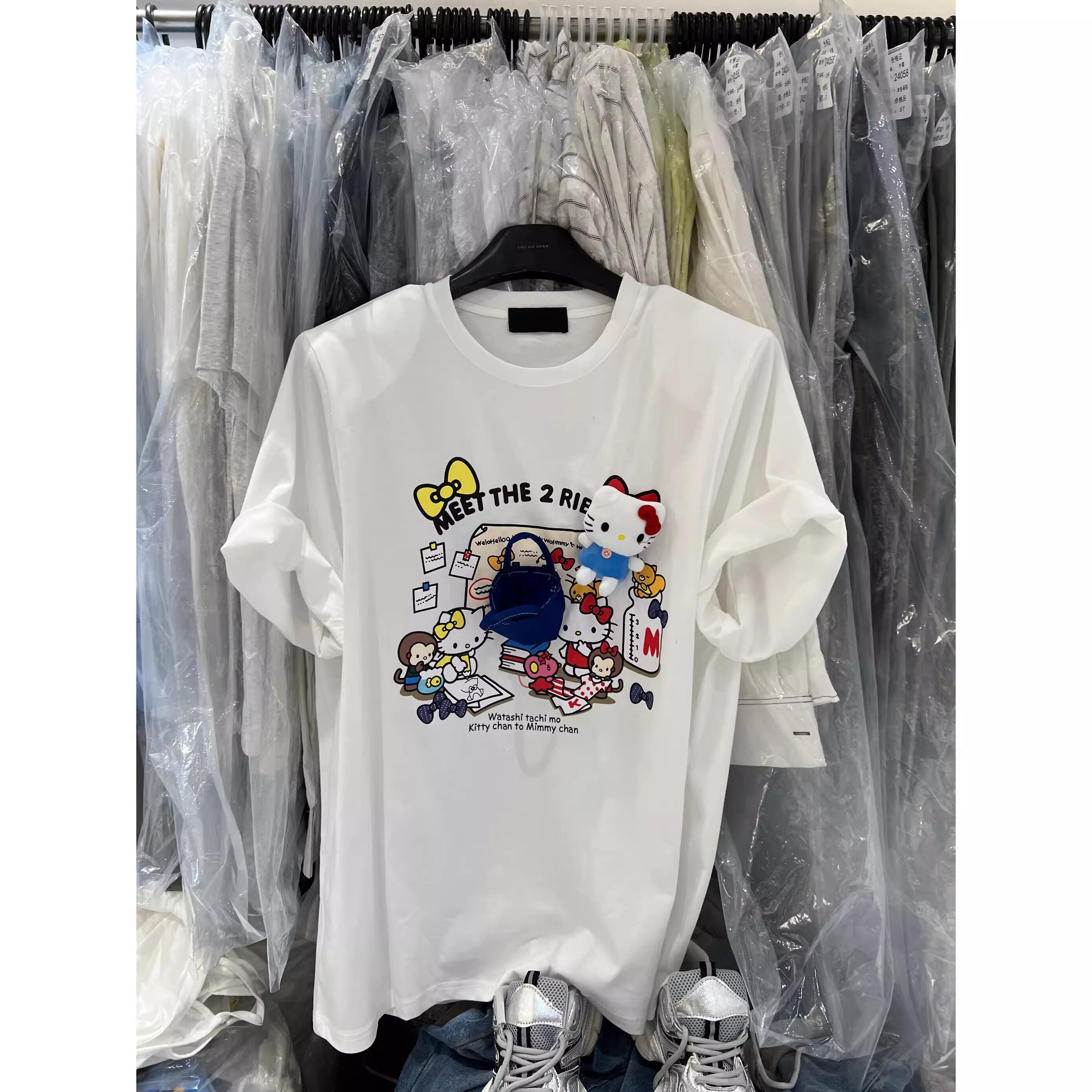 A238 - Hello Kitty Graphic T-Shirt with 3D Plush Doll & Creative Mini Handbag Ornament