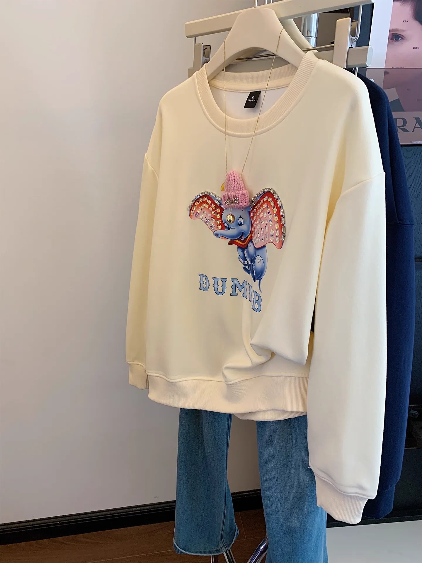 Dumbo Sweatshirt - with ears covered in shiny rhinestones and wearing a three - dimensional plush small hat