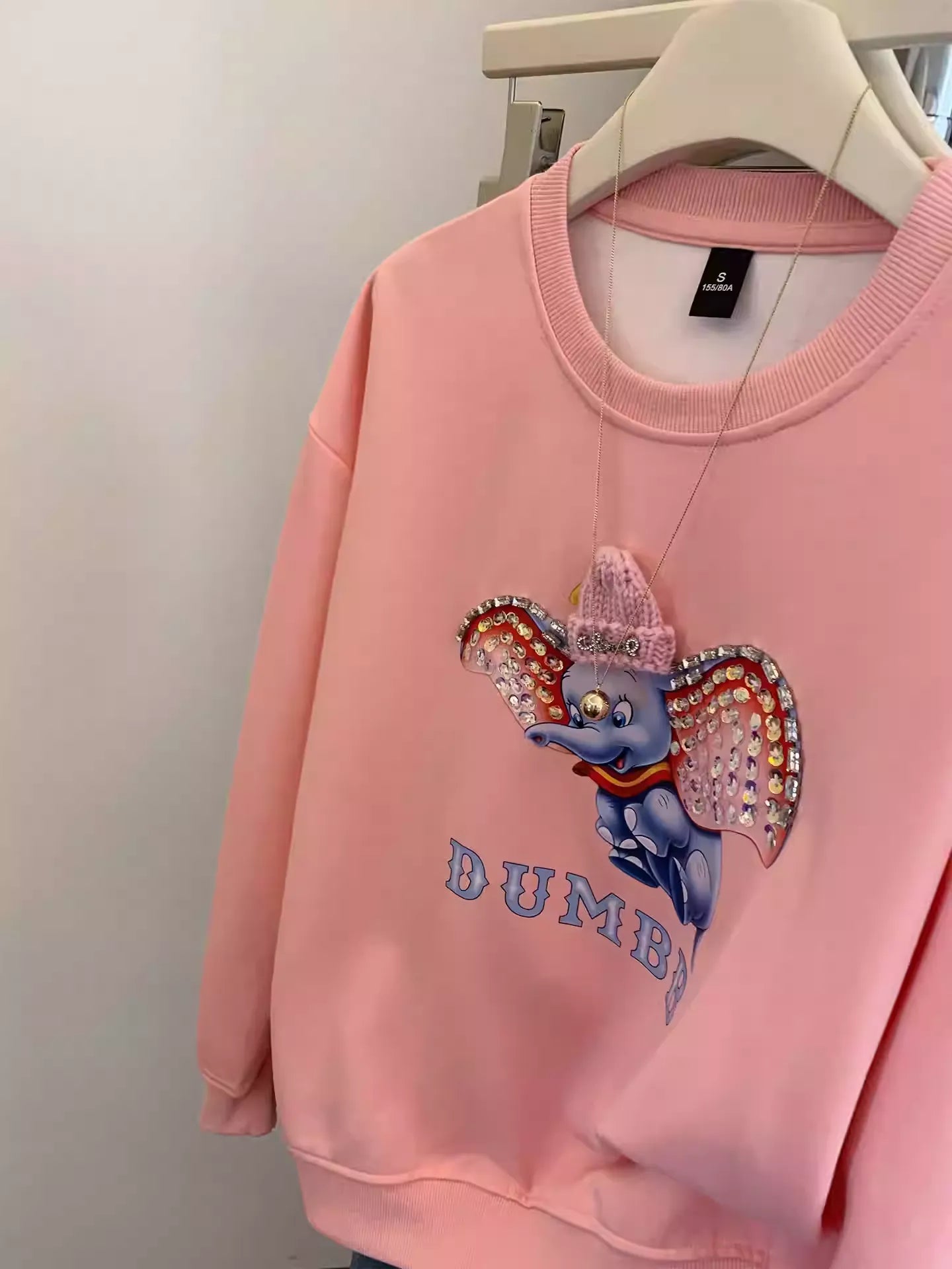 Dumbo Sweatshirt - with ears covered in shiny rhinestones and wearing a three - dimensional plush small hat