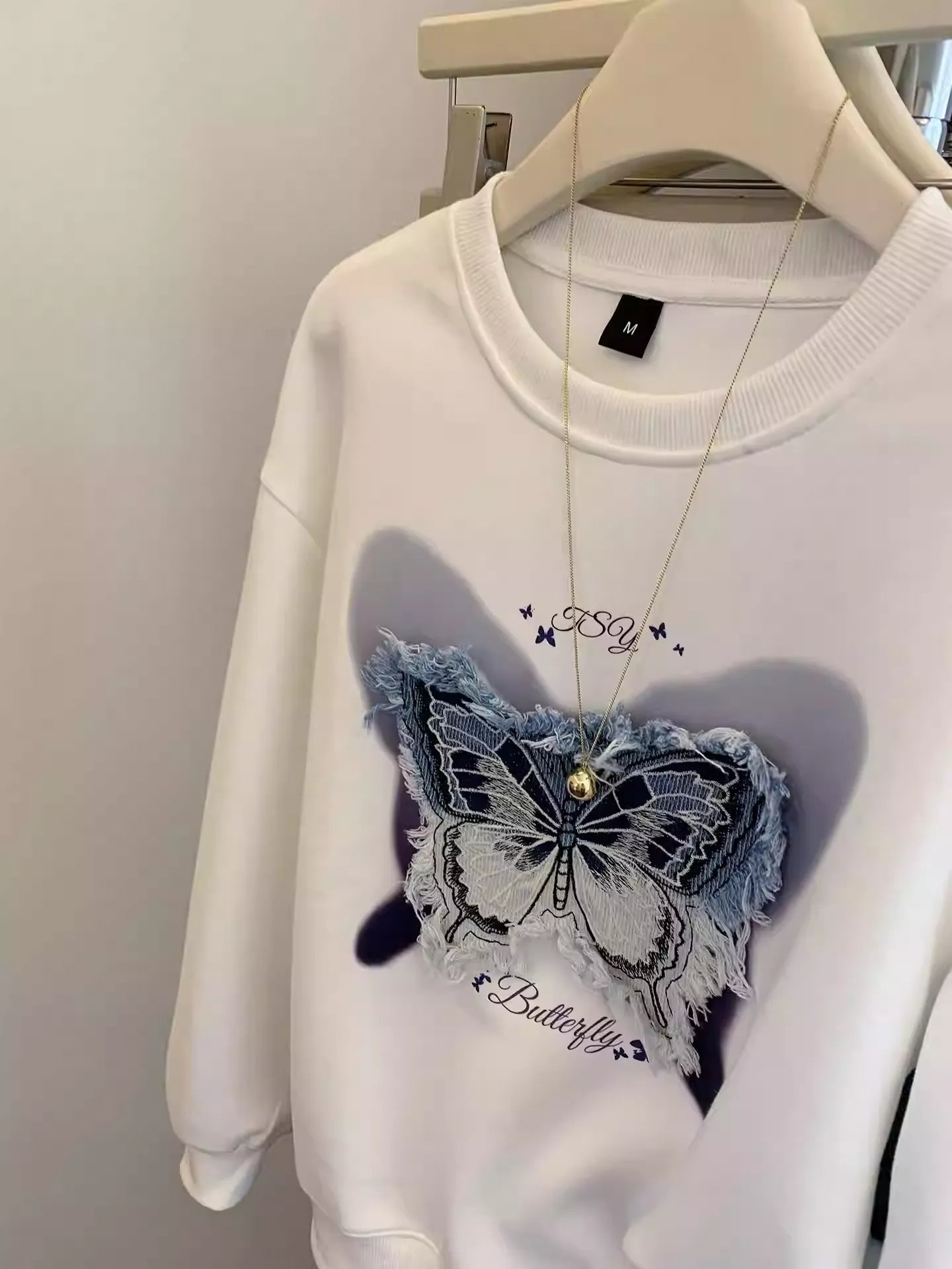 Casual Streetwear: White Sweatshirt w/ Denim Butterfly Patch