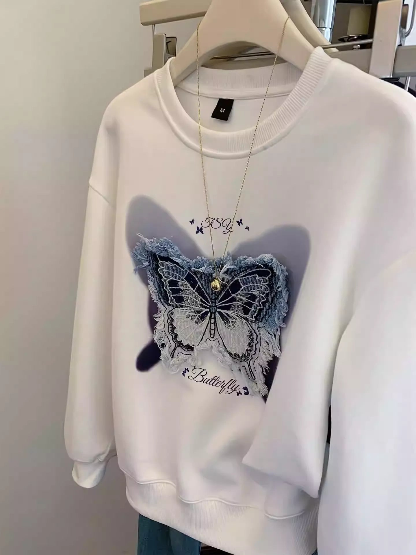 Casual Streetwear: White Sweatshirt w/ Denim Butterfly Patch