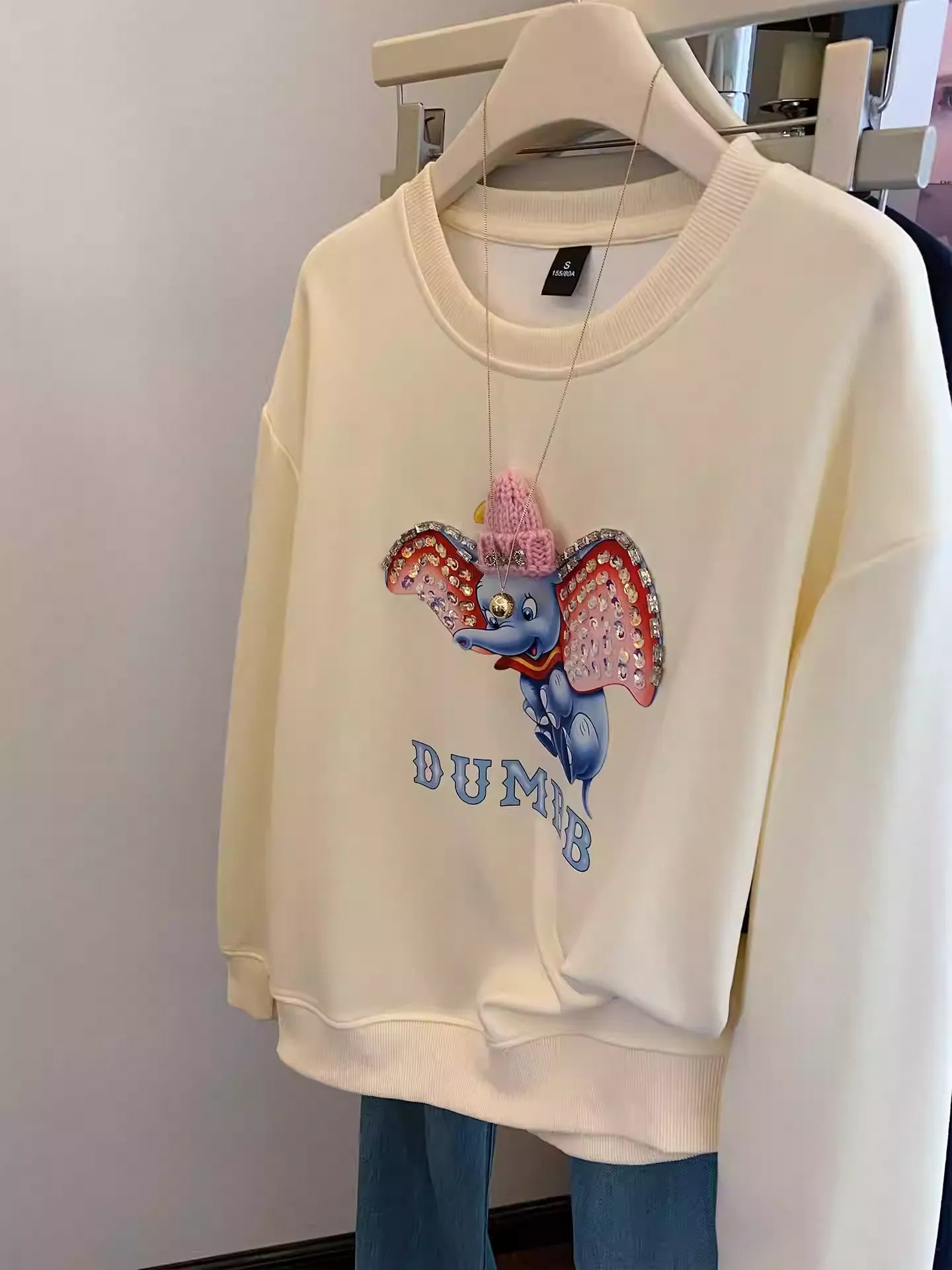 Dumbo Sweatshirt - with ears covered in shiny rhinestones and wearing a three - dimensional plush small hat